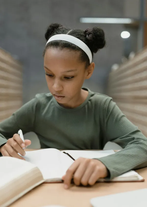 little girl reading and studying