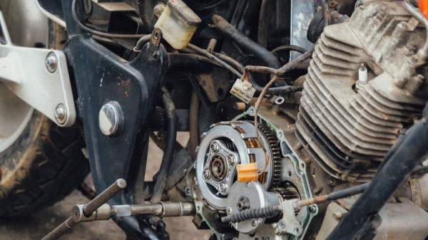 Motorcycle mechanics are assembling the motorcycle engine clutch assembly and maintenance