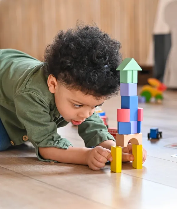child playing with building blocks