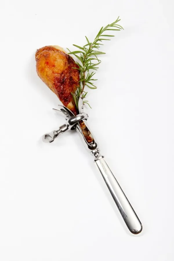 Silver drumstick holder with a roasted chicken drumstick and rosemary sprig.