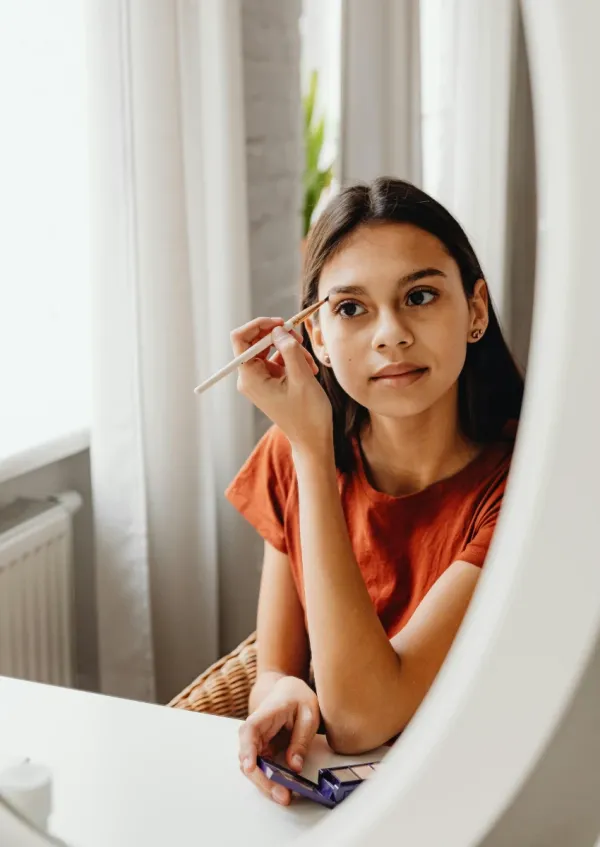 woman easily fixing problem with her appearance