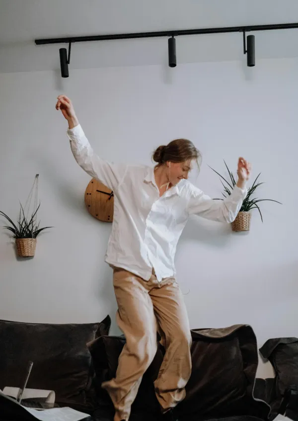 woman dancing to music on Spotify