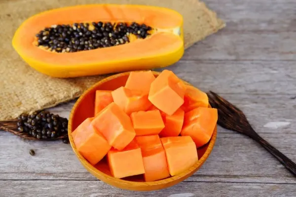 Healthy of sweet papaya slices on plate and wooden background. Healthy food and close up.