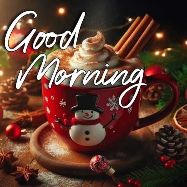 This may contain: a cup filled with hot chocolate sitting on top of a wooden table next to christmas decorations