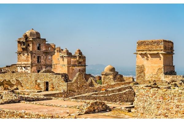This may contain: the ruins of an old city with stone walls and towers are seen in this image