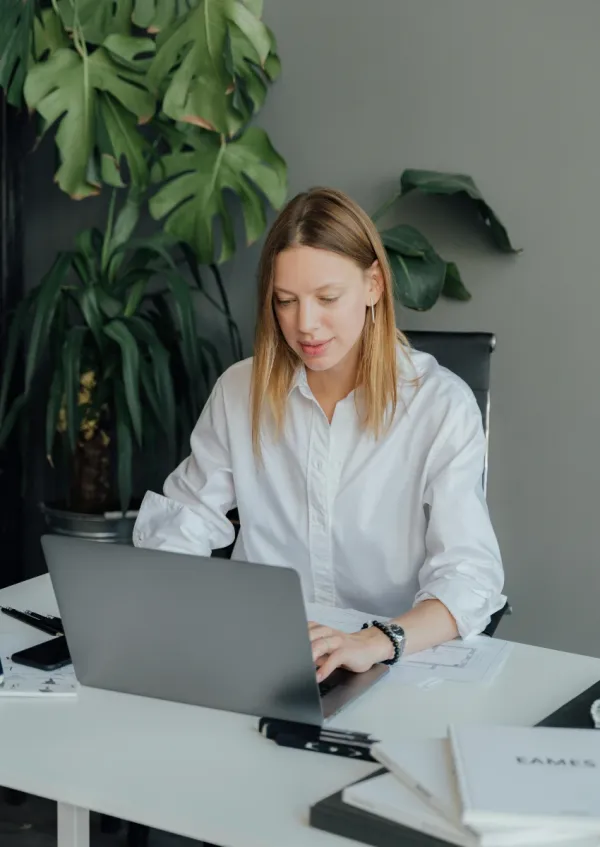 woman working in an office at a traditional job