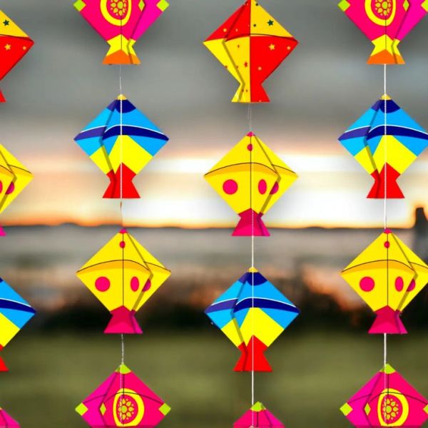 This may contain: several colorful kites hanging from strings on a string