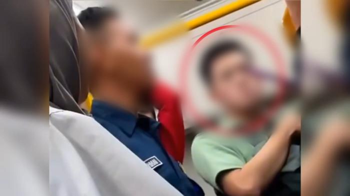 ASUSILA DITRANSJAKARTA - Video viral di media sosial dua pria yang tertangkap basah sedang melakukan tindakan asusila di dalam transportasi umum Transjakarta. (Dok. Istimewa).