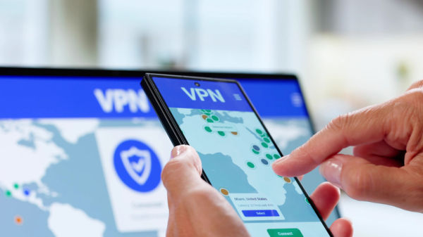 Representation of a VPN on phone and laptop.