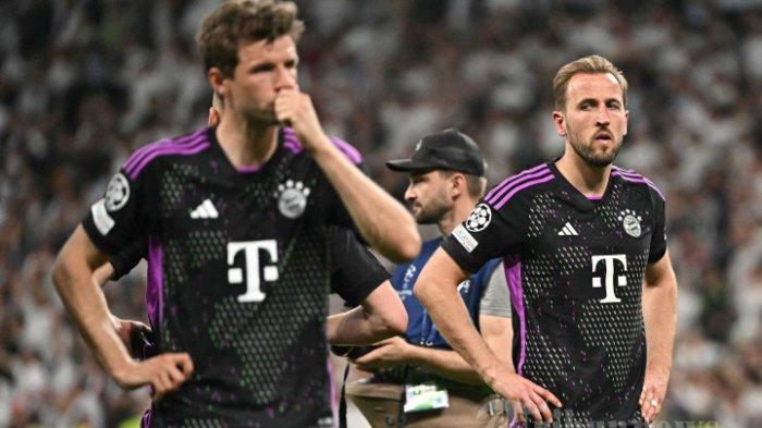 MUNCHEN MENANG TELAK - Reaksi penyerang Inggris Bayern Munich Harry Kane dan rekan satu timnya atas kekalahan mereka setelah pertandingan sepak bola leg kedua semifinal Liga Champions UEFA antara Real Madrid CF dan FC Bayern Munich di stadion Santiago Bernabeu di Madrid pada 8 Mei 2024. (Photo by JAVIER SORIANO / AFP)