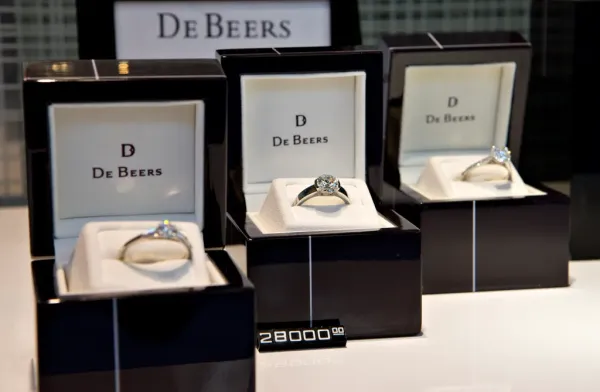 Diamond engagement rings in De Beers window display.