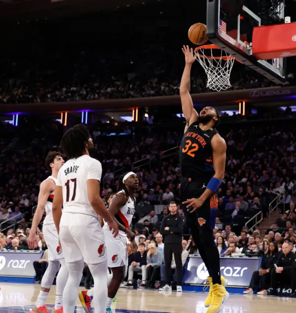 Karl-Anthony Towns #32 of the New York Knicks puts up a shot as Shaedon Sharpe #17 of the Portland Trail Blazers watches in the second half at Madison Square Garden in New York, New York, Friday, January 30, 2026.