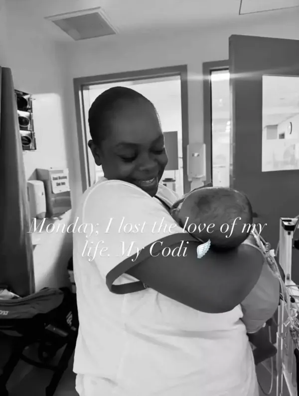 Cori Broadus holding her baby daughter