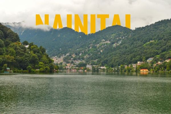 This may contain: a lake with mountains in the background and yellow text over it that says nanita