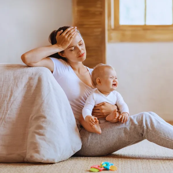 overwhelmed mom with baby