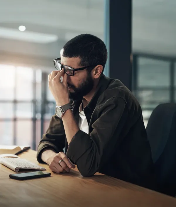 people-pleaser man experiencing burnout at job