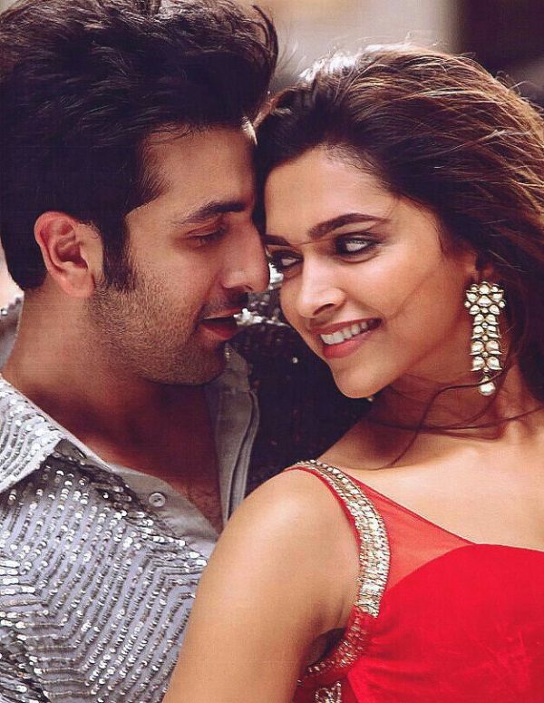 This may contain: an image of a man kissing a woman