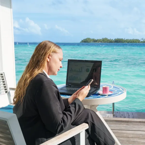 woman working on vacation has a bad work-life balance