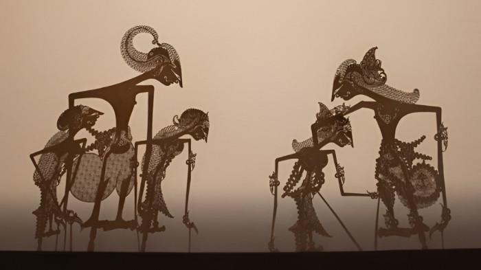 WAYANG KULIT- Ilustrasi sebuah pertunjukan wayang kulit yang merupakan bagian dari kesenian masyarakat Jawa.