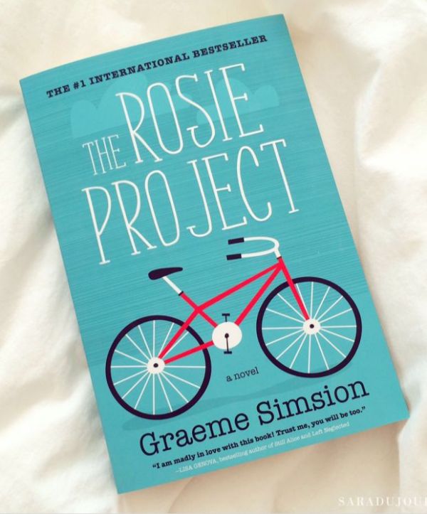 This may contain: the book cover for the rose project by cremee simpsonon on a bed