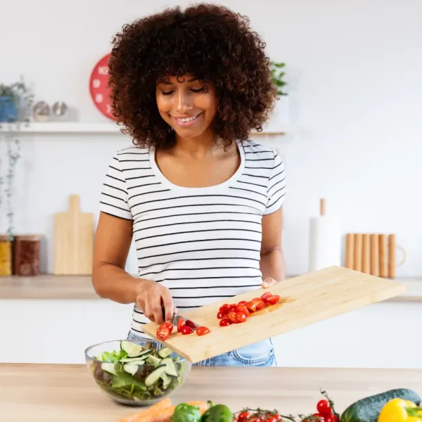 woman chopping vegetables in kitchen things avoid during chinese new year for prosperous fire horse year