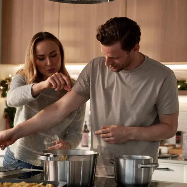couple being intentional and not over spicing while cooking