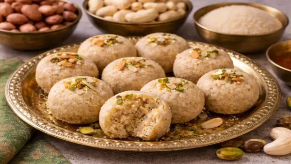 Peanut and cashew fasting pedas garnished with chopped nuts on a brass plate.