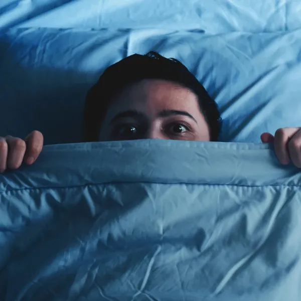 man waking up from a nightmare