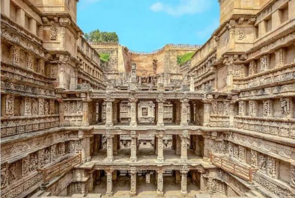 This may contain: the inside of an old building with many carvings on it's walls and pillars