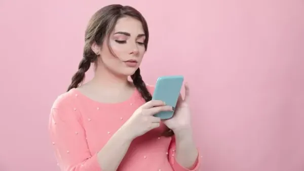 woman looking at her mobile phone