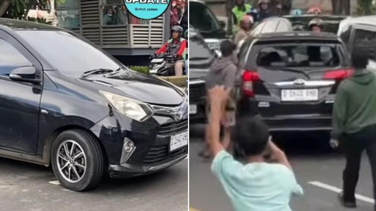 MOBIL LAWAN ARUS - Toyota Calya hitam dikejar massa usai lawan arus di Gunung Sahari, Jakarta Pusat.