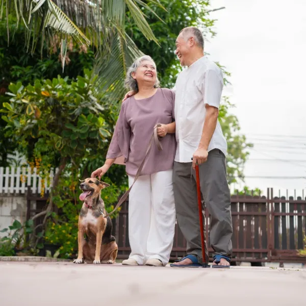 married couple walking their dog good friends