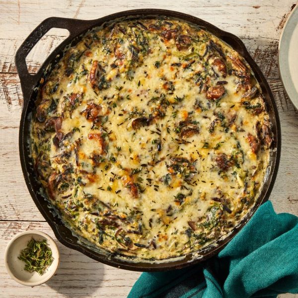 an image of the Creamy Spinach, Mushroom, & Wild Rice Casserole Credit: Photographer: Jen Causey, Food Stylist: Emily Nabors Hall, Prop Stylist: Julia Bayless