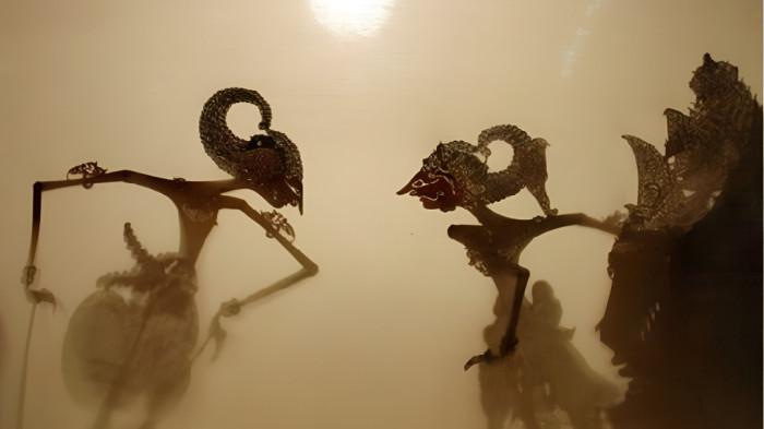 WAYANG KULIT- Ilustrasi pertunjukan wayang kulit yang merupakan kesenian masyarakat Jawa.