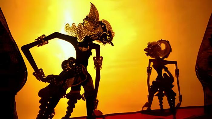 WAYANG KULIT- Ilustrasi pagelaran wayang kulit yang merupakan tradisi masyarakat Jawa.