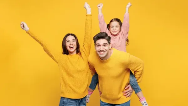 a family of three cheering up