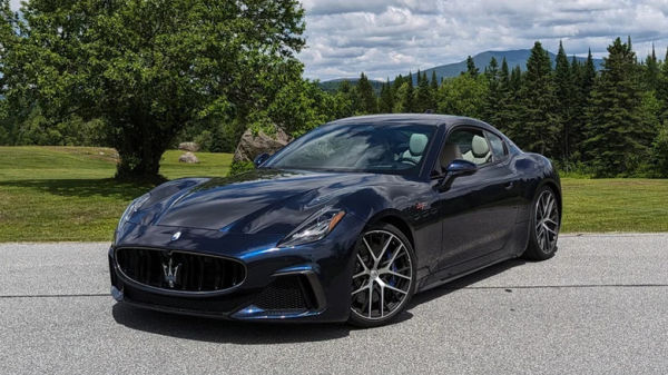 Maserati GranTurismo Trofeo parked near the forest