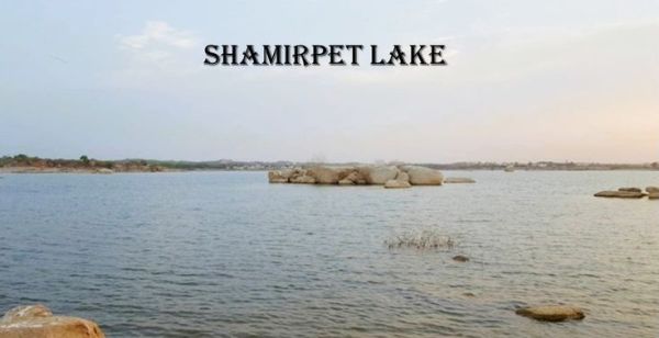 This may contain: there are rocks in the water with words above them that read, shampet lake