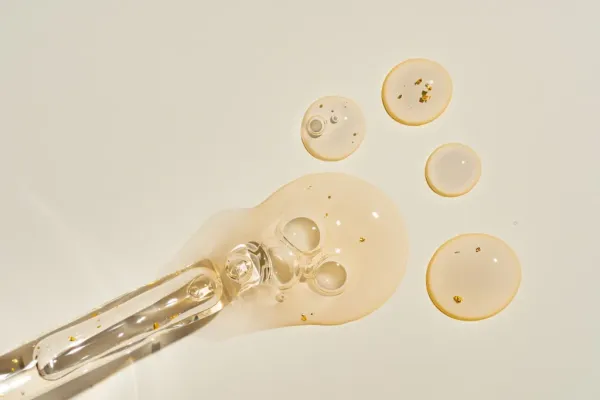 A dropper leaking serum.