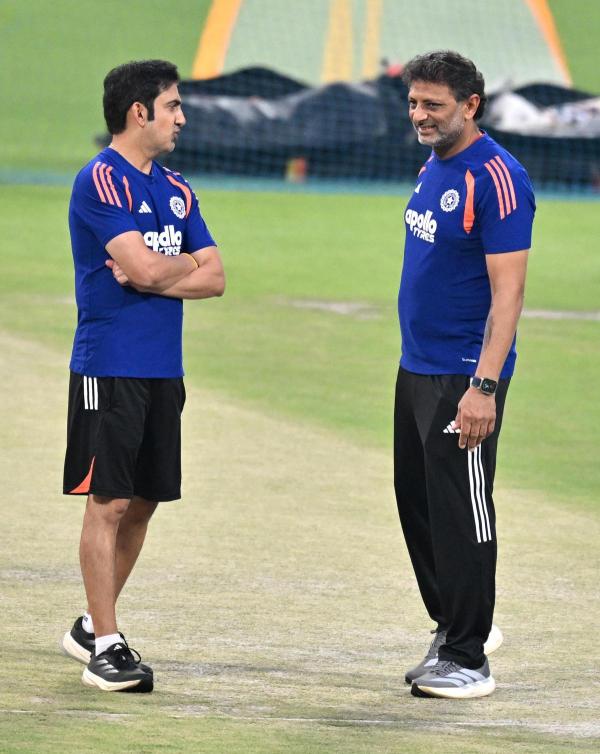 The think-tank: Kotak checking the pitch along with head coach Gambhir (L) during a practice session ahead of India’s match against West Indies.