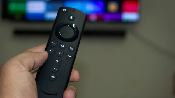 Amazon fire stick TV remote in hand