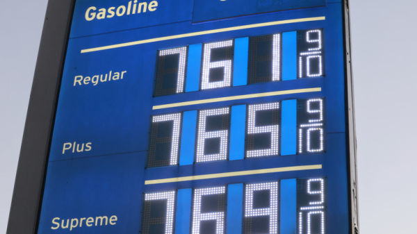 A sign displaying gas prices over $7.60 a gallon