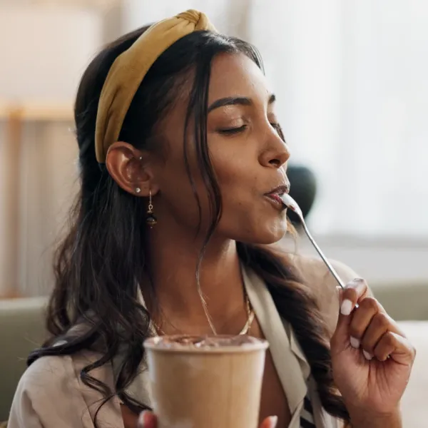 woman licking ice cream off spoon lower risk of diabetes