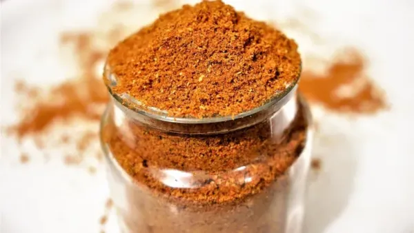 Aromatic homemade pav bhaji masala stored in an airtight container.