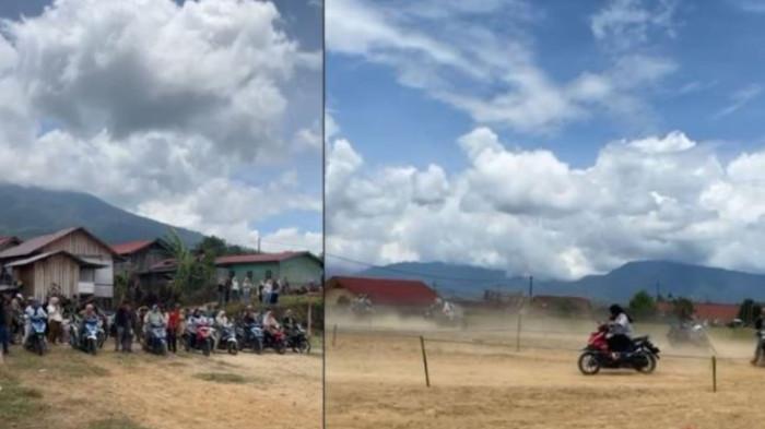BALAPAN - Ibu-ibu balapan motor matic di Lapangan Sepak Bola Desa Renah Alai, Kecamatan Jangkat, Kabupaten Merangin. Lokasi itu berlatar pemandangan Gunung Masurai yang indah.