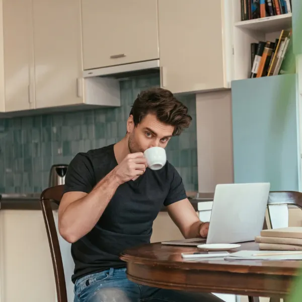 man drinking coffee has less inflammation in his body