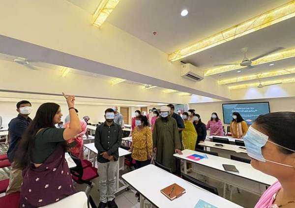 Accessibility advocate Disha Kapadia leads a guided activity demonstrating sensory perception and orientation techniques for visually impaired individuals.