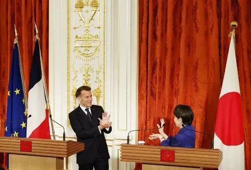 Japan's Prime Minister Sanae Takaichi and French President Emmanuel Macron react during a press conference at Akasaka Palace in Tokyo on April 1, 2026. (Photo by Franck ROBICHON / POOL / AFP)