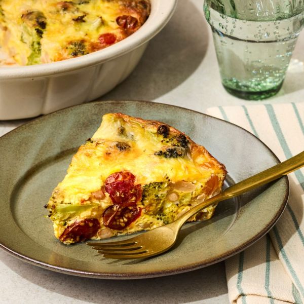 a recipe photo of Broccoli, Tomato & White Bean Quiche Credit: Photographer: Victor Protasio, Food Stylist: Chelsea Zimmer, Prop Stylist: Hannah Grennwood.