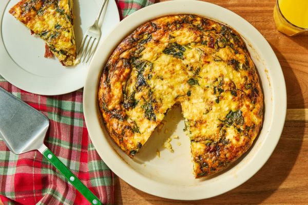 an image of the Simple Christmas Morning Quiche Credit: Photographer: Greg DuPree, Food Stylist: Chelsea Zimmer, Prop Stylist: Abby Armstrong